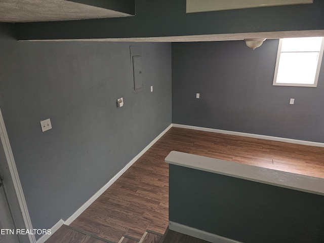 basement featuring dark wood-type flooring