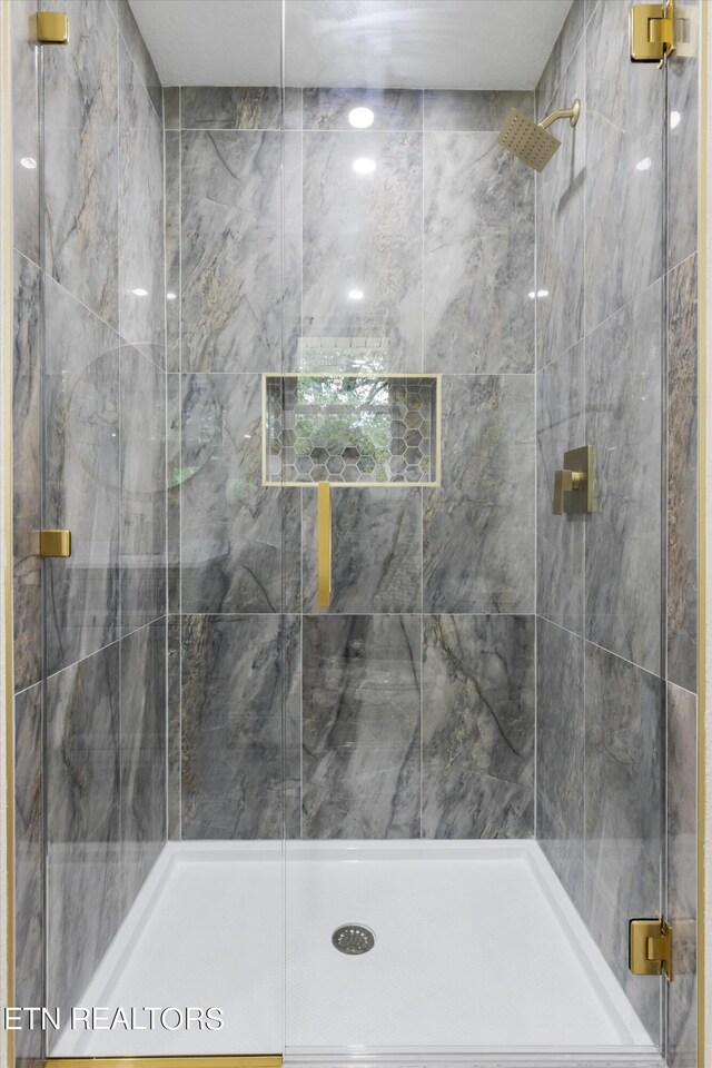 bathroom with an enclosed shower