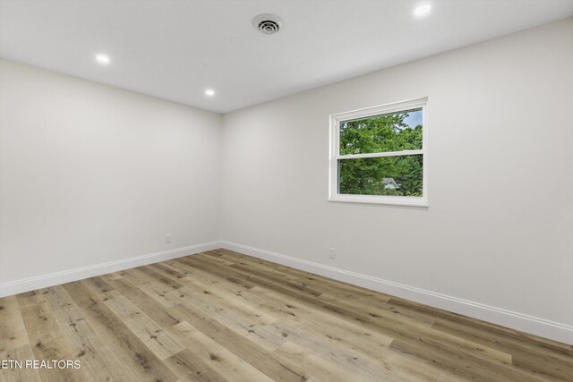 spare room with light hardwood / wood-style floors