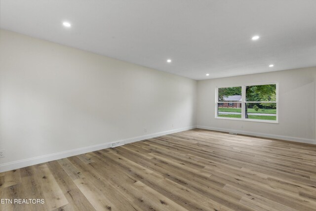 unfurnished room featuring light hardwood / wood-style floors