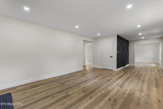 empty room with light hardwood / wood-style floors