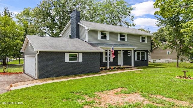 view of front facade featuring a garage, covered porch, and a front lawn