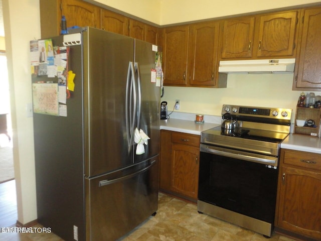 kitchen with stainless steel appliances and light tile patterned floors