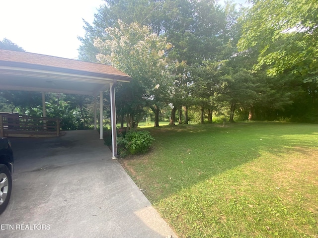 view of yard featuring a carport