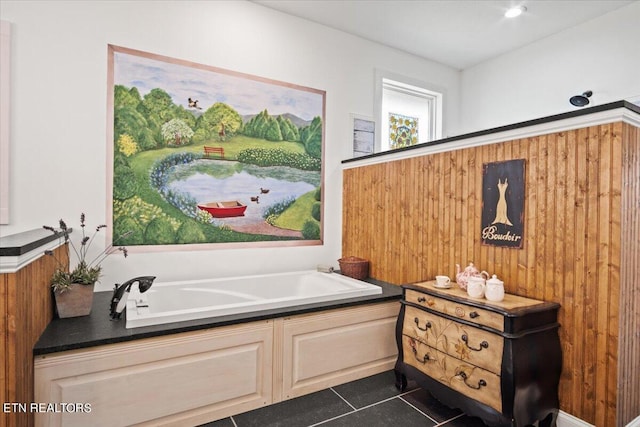 bathroom featuring tile patterned floors and a bathtub