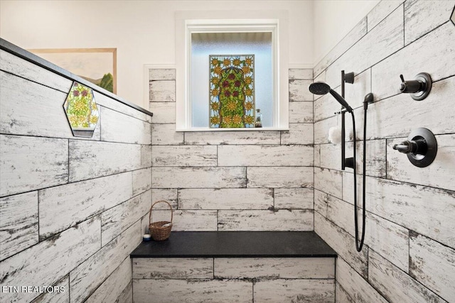 bathroom featuring a tile shower