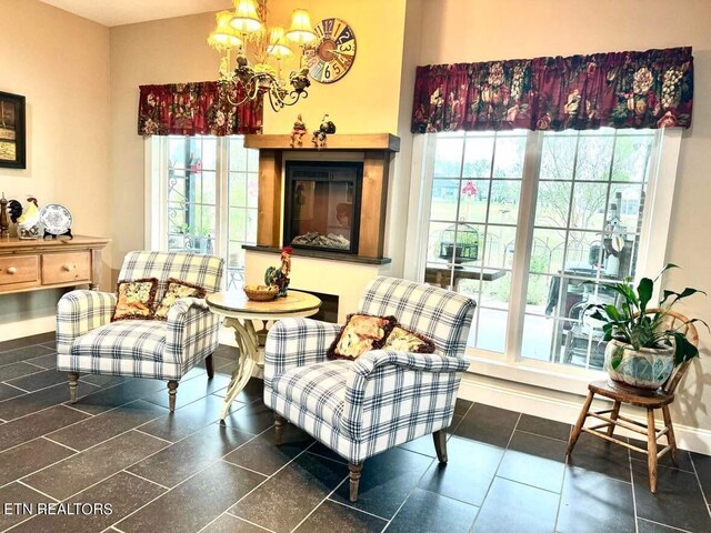 sitting room featuring an inviting chandelier