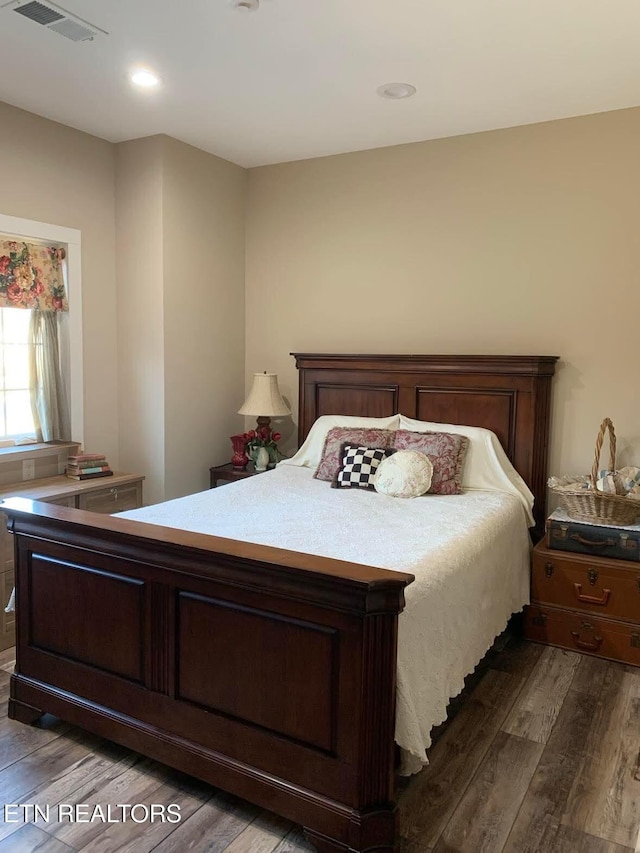 bedroom featuring dark hardwood / wood-style floors