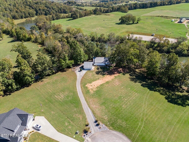 drone / aerial view featuring a rural view and a water view