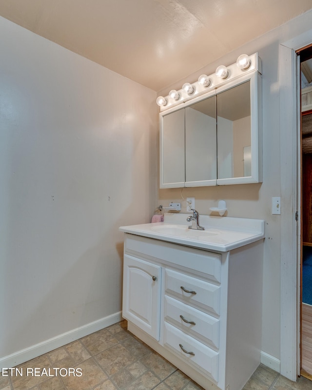 bathroom with tile patterned flooring and vanity