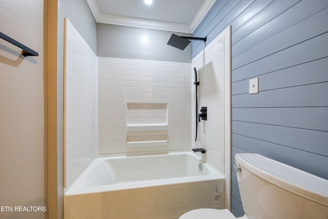 bathroom featuring tiled shower / bath, ornamental molding, and toilet