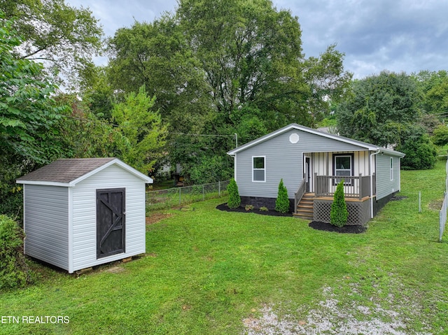 exterior space with a storage shed and a front lawn