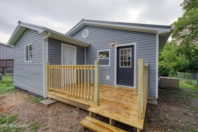 rear view of property with a deck