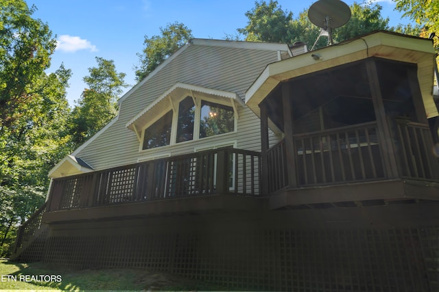 view of side of property with a wooden deck