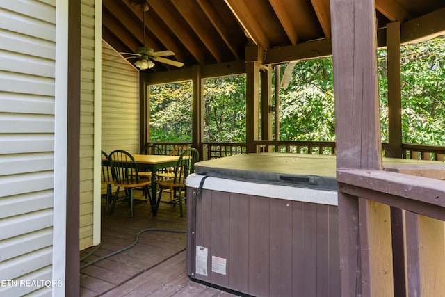 wooden terrace featuring a hot tub and ceiling fan