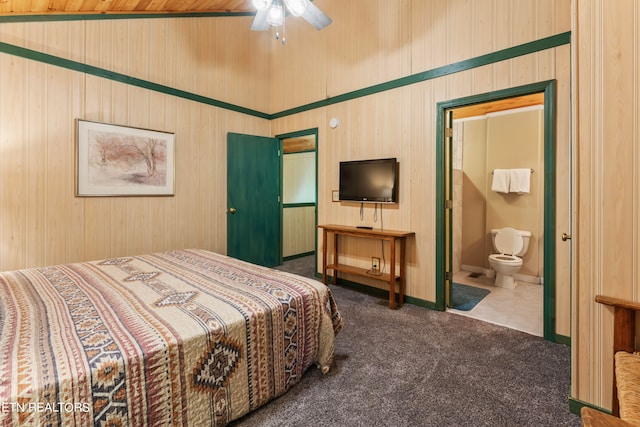 bedroom with wood ceiling, dark colored carpet, high vaulted ceiling, connected bathroom, and ceiling fan