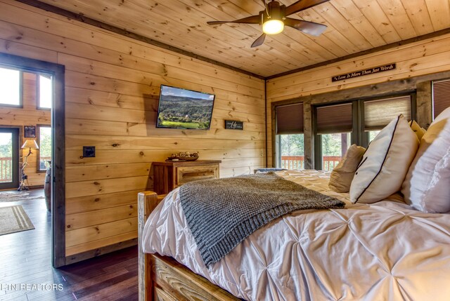 bedroom with wood ceiling, multiple windows, ceiling fan, and hardwood / wood-style floors