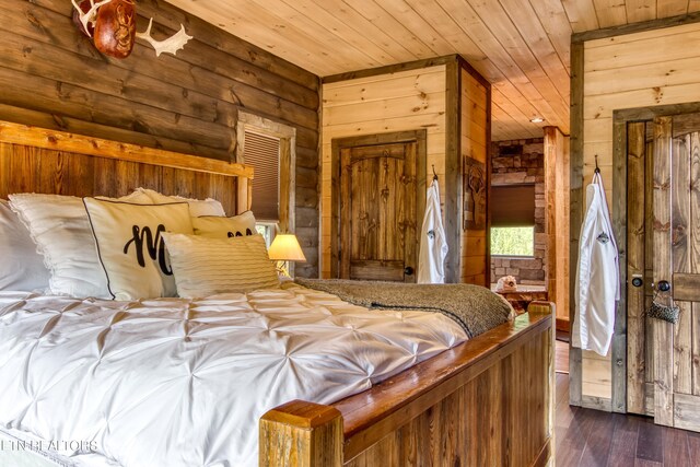 bedroom featuring wooden walls, dark hardwood / wood-style flooring, and wood ceiling