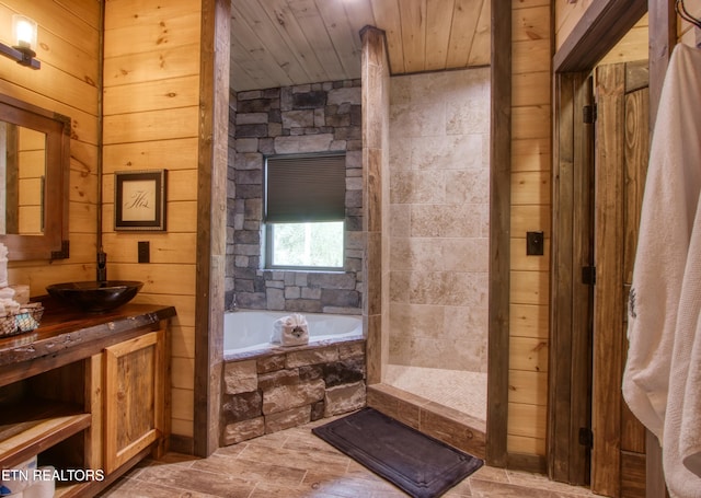 bathroom with wood walls, wood ceiling, vanity, and a bathtub