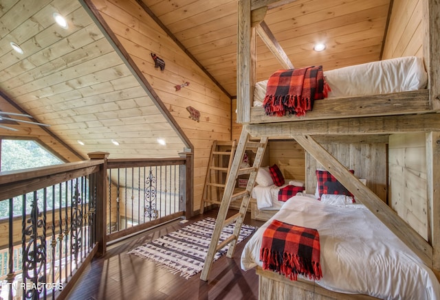 bedroom with hardwood / wood-style floors, lofted ceiling, wood ceiling, and wooden walls