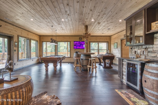 playroom with wood walls, wooden ceiling, and dark hardwood / wood-style floors