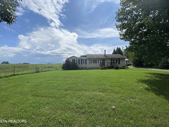 view of front of property with a front lawn