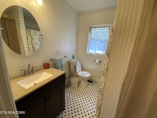 bathroom featuring tile patterned floors, vanity, and toilet