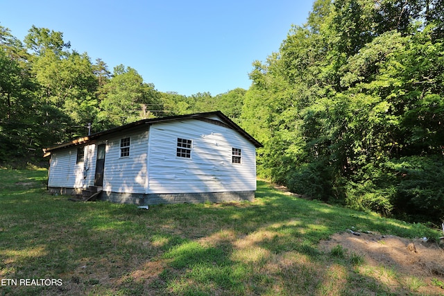 view of home's exterior featuring a yard