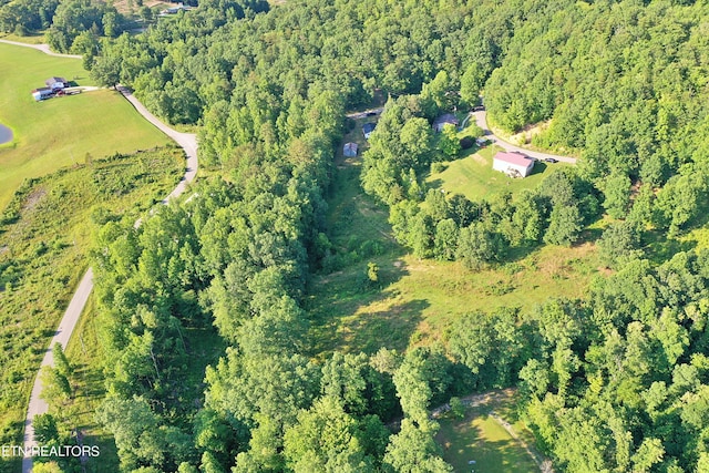 aerial view featuring a forest view