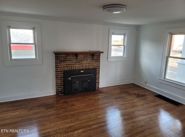 unfurnished living room with ornamental molding and dark wood-type flooring