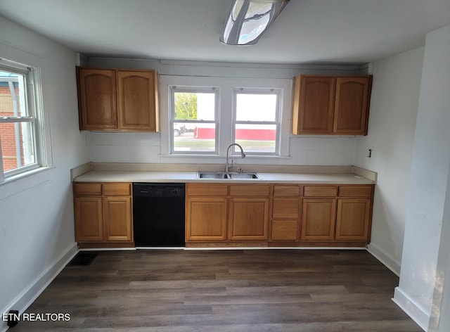 kitchen featuring dark hardwood / wood-style floors, black dishwasher, and sink