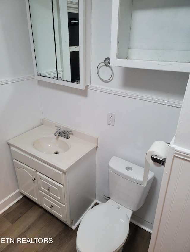 227 Gill St, Alcoa, TN 37701 - bathroom featuring vanity, wood finished floors, and toilet