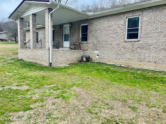 view of side of home featuring a lawn