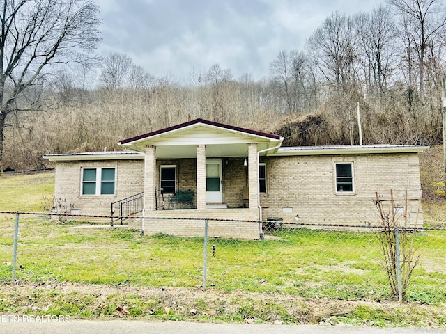 view of front of home featuring a front lawn, a fenced front yard, a porch, crawl space, and brick siding