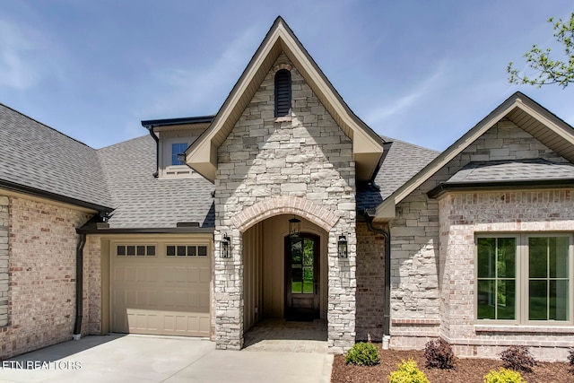 french country home featuring a garage