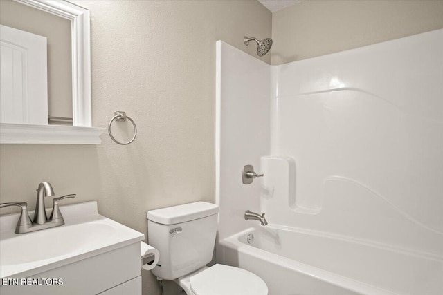 full bathroom featuring vanity, toilet, and washtub / shower combination