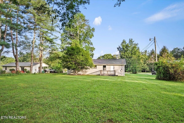 view of yard featuring a deck