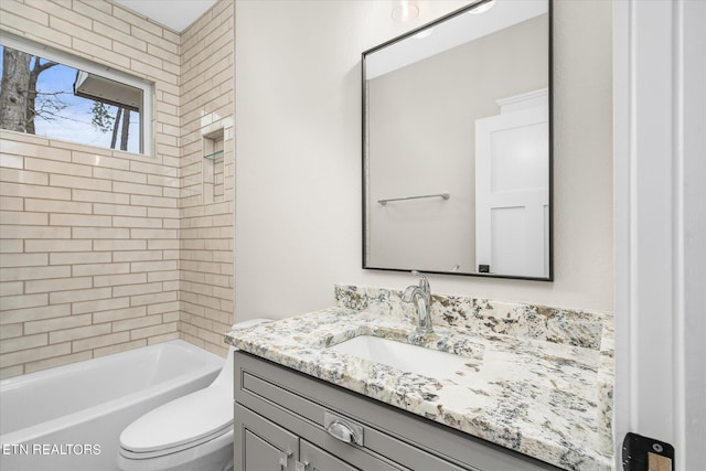 full bathroom featuring vanity, toilet, and tiled shower / bath combo