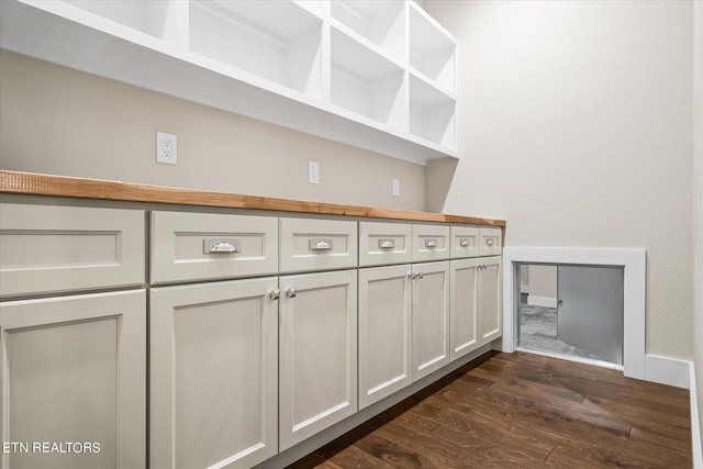 interior space with white cabinetry and dark hardwood / wood-style flooring