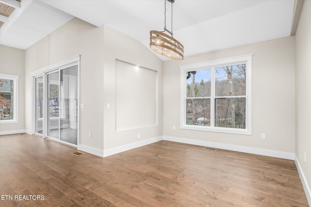 interior space featuring wood-type flooring and a chandelier