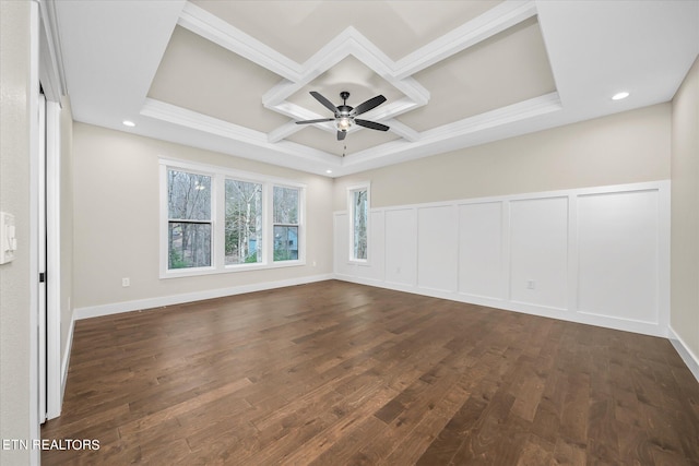spare room with coffered ceiling, dark hardwood / wood-style flooring, beamed ceiling, and ceiling fan