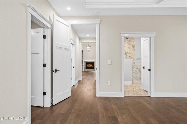 hall with dark hardwood / wood-style flooring