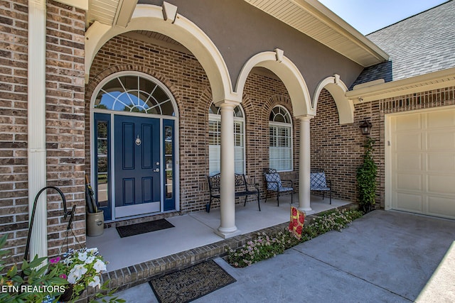 view of exterior entry featuring a garage