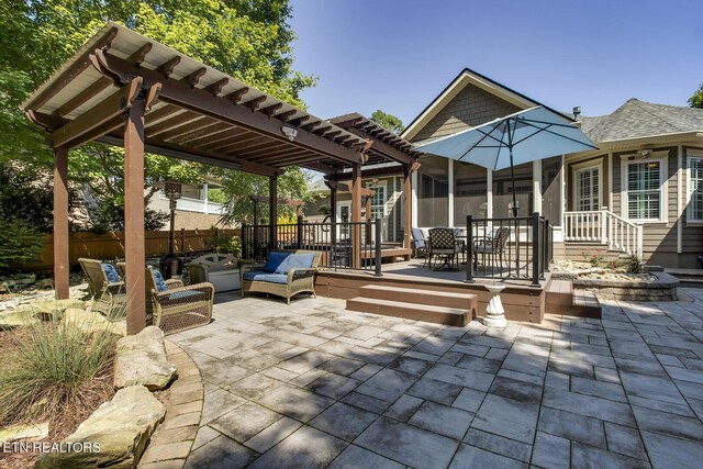 view of patio with a pergola and a deck