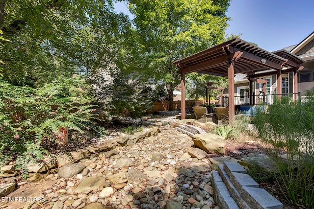 view of yard featuring a patio and a pergola