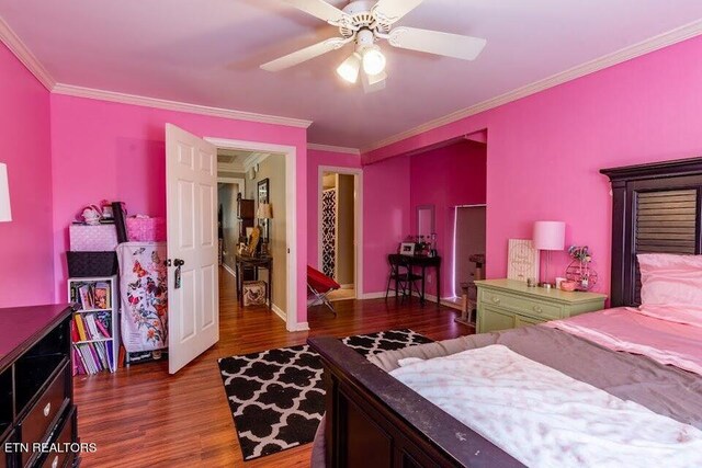 bedroom featuring dark hardwood / wood-style floors, ornamental molding, and ceiling fan