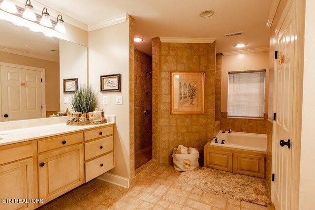 bathroom featuring crown molding, vanity, tile walls, shower with separate bathtub, and tile patterned floors