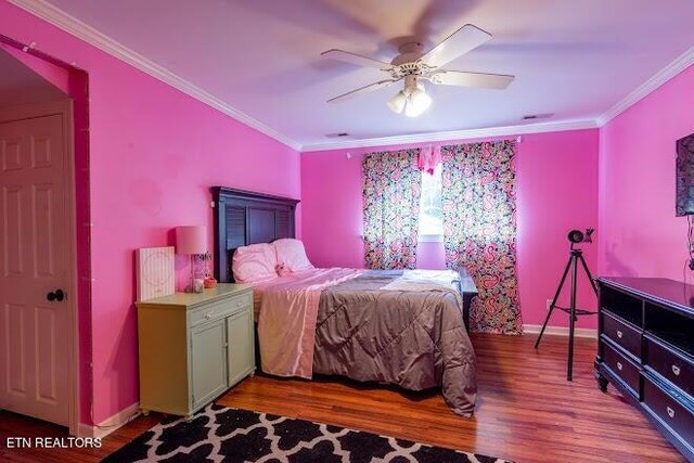 bedroom featuring ceiling fan, hardwood / wood-style flooring, and ornamental molding