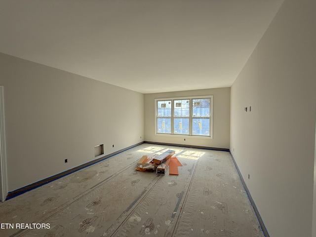 empty room with baseboards