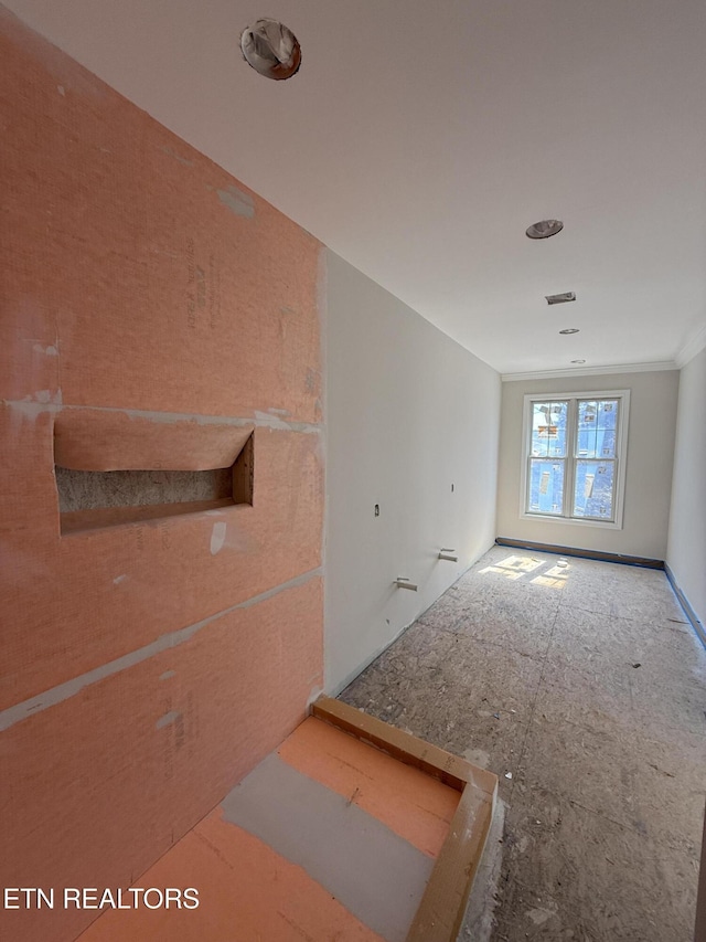 spare room featuring crown molding and visible vents